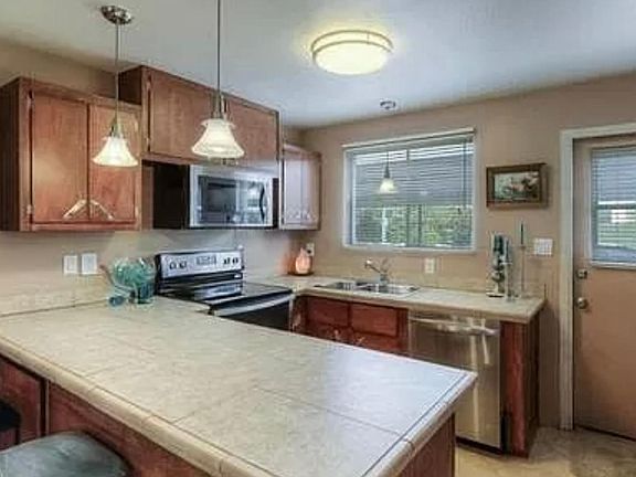 3rd image of 6936 E 4th St APT 12