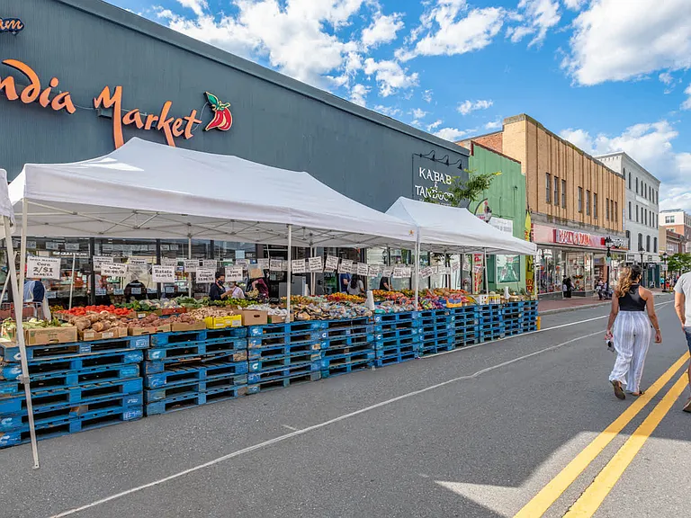 Close to grocery stores and outdoor markets along Moody Street.