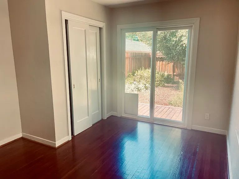 Second bedroom with backyard views