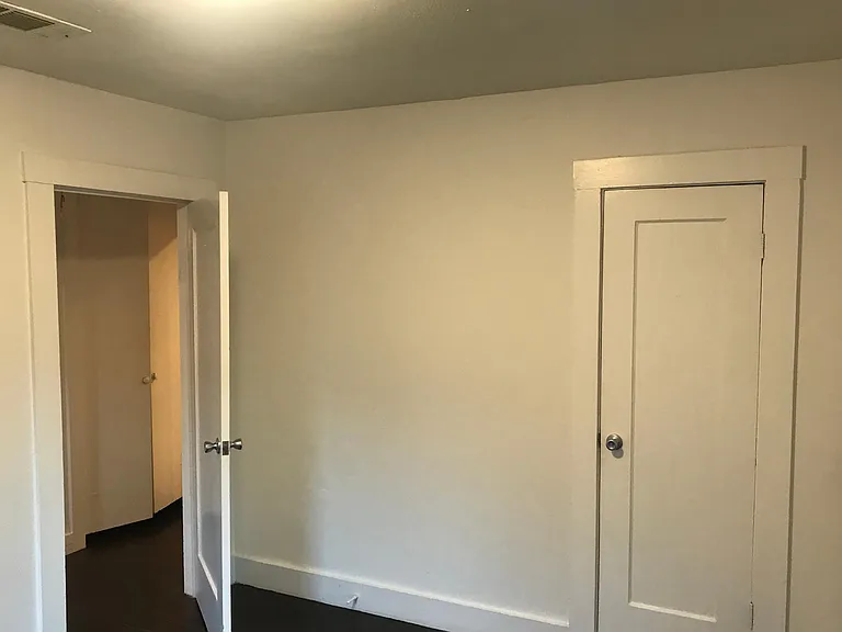Bedroom door to Hall and bathroom on left and closet door on right