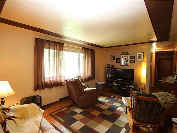Beautiful Front Picture Window calling in the Natural Light! Quality Plaster Walls thru-out & Original Hardwood Floors in most r