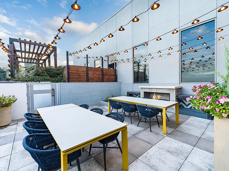 Host rooftop dinners at Modera Old Ivy, where firelit tables and skyline views set the scene just minutes from Buckhead.