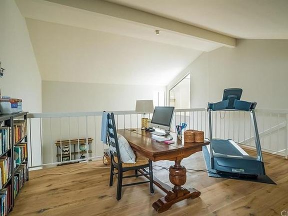 Large loft can be used for home office and/or additional bedroom.