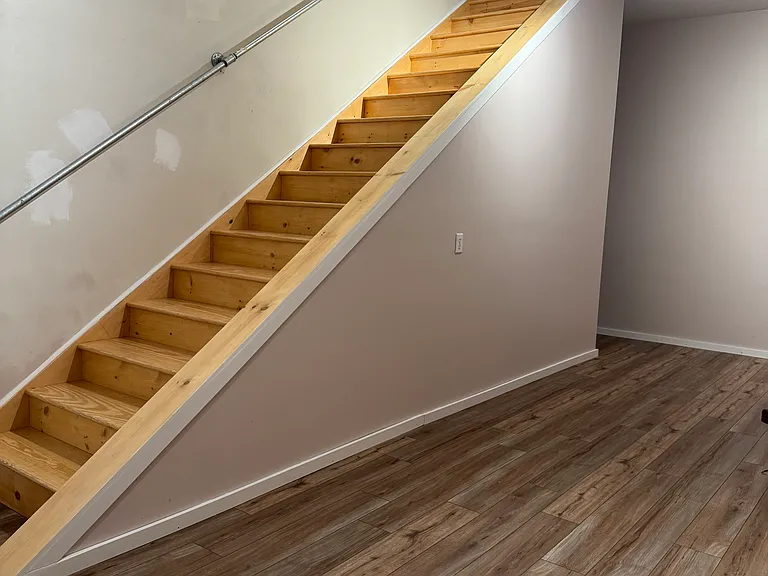 First floor space with stairs to apartment prior to current tenant. Tons of storage under steps!