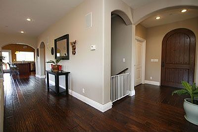 Entryway with wide-planked hardwood floor