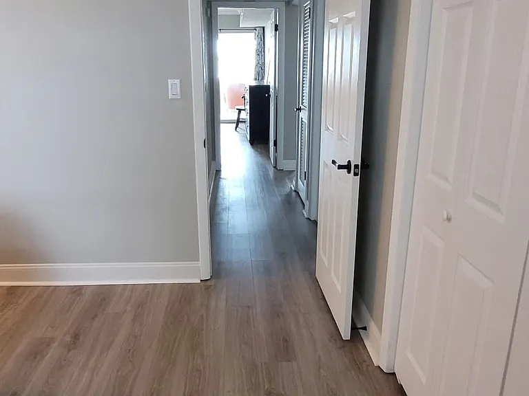 Guest bedroom closet and view down the hallway