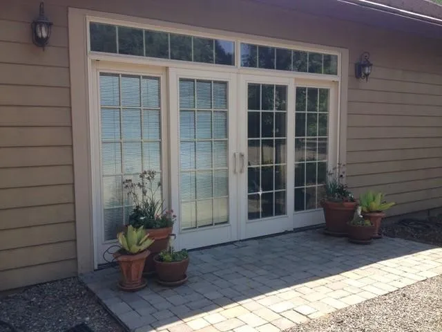 Sliding french doors in front provide lots of light - 4349 Whispering Oak Cir