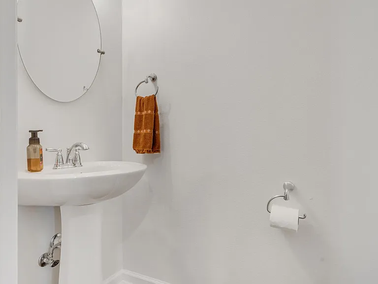 Half Bath by Kitchen and Living Area