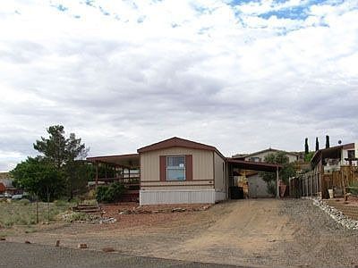 Front of Home with Carport