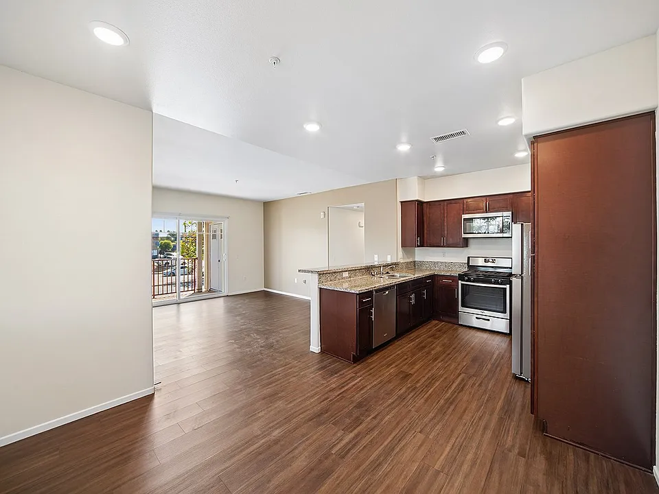 Breakfast Bar Open to Dining and Living Areas