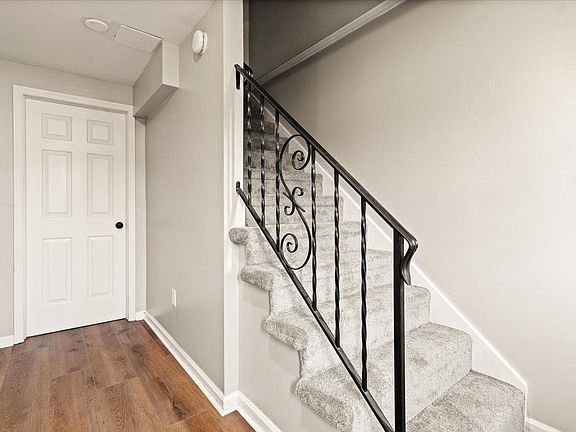 Laundry room. Garage to left. Stairs to main level.