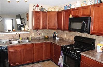 Kitchen with pass through to great room.