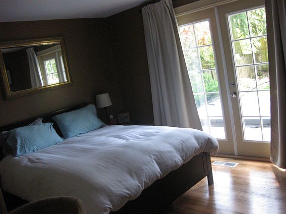 Master bedroom with direct access to back deck and hot tub!