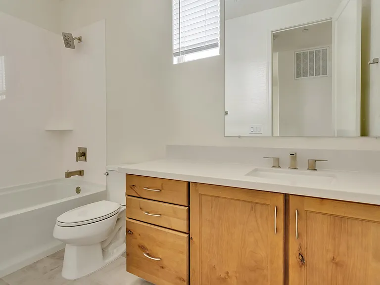 Second bathroom has combination bathtub/shower.
