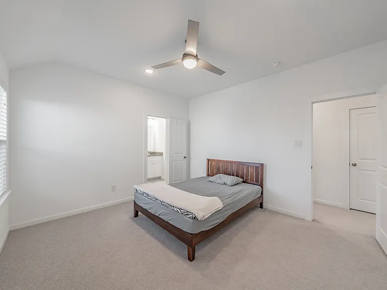large secondary bedroom with walk in closet on second floor