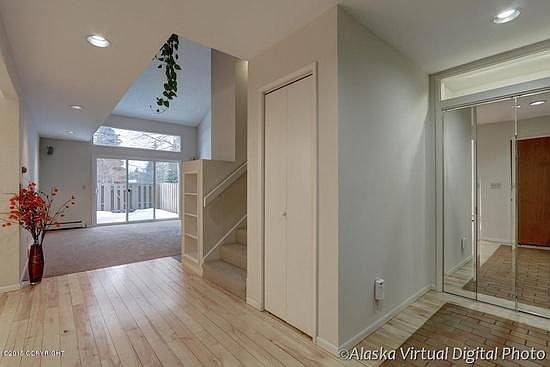 Entry and 2 coat closets. Entry to living room.