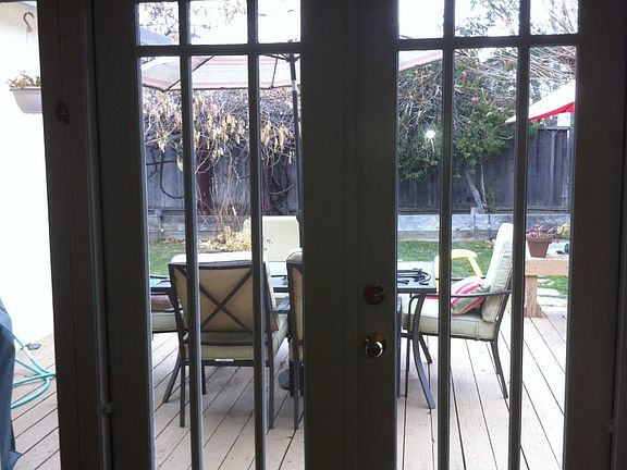 Door to deck and backyard