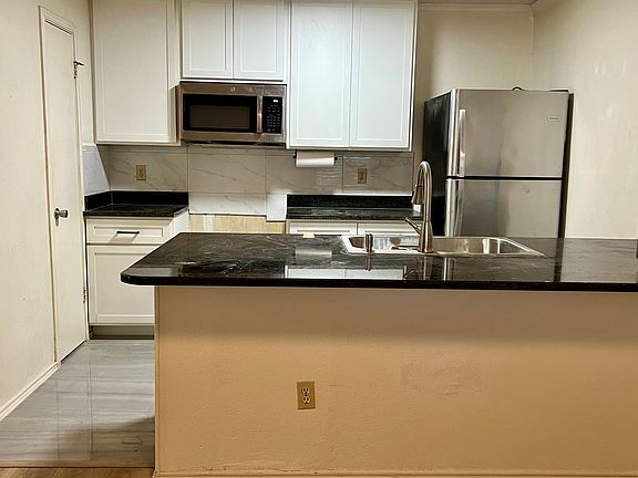 Newly renovated kitchen with bar overhang counter
