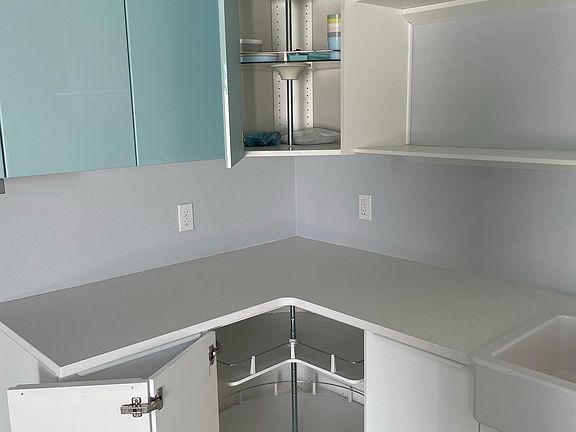 Corner cabinets have spinning carousel in both