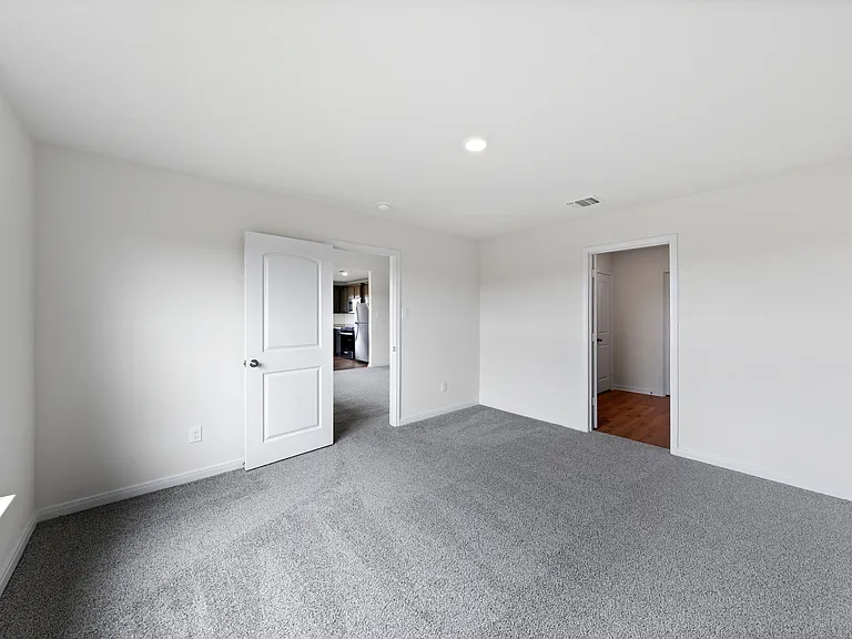 The master suite has a spacious bedroom, en-suite bathroom and walk-in closet.