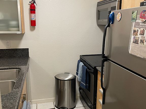 Kitchen, complete with IKEA cabinets. Compact and includes silverware, dishes, pots and pans.