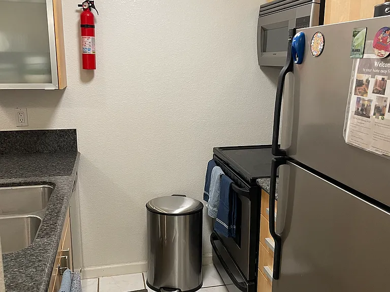 Kitchen, complete with IKEA cabinets. Compact and includes silverware, dishes, pots and pans.