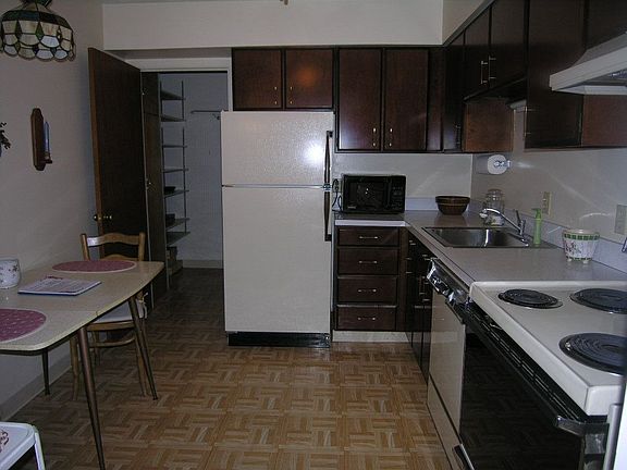 spacious kitchen in suite laundry