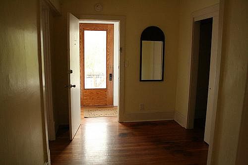 looking back from foyer, apartment door open, exterior door closed
door to left = bedroom 1
door to right = closet