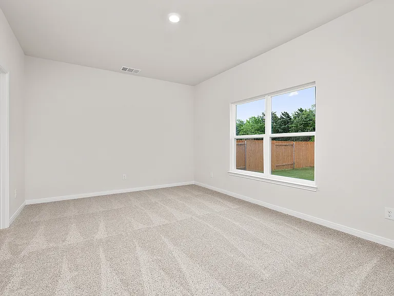 The master suite has a large bedroom, ensuite bathroom and a walk-in closet.