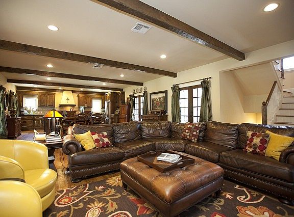 Grand open floor plan combines den and dining