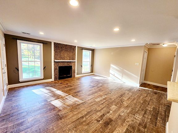 Living room, with wood burning fireplace.