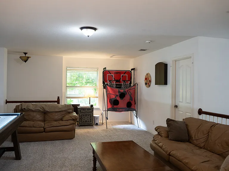 Loft area with entrance to media/workout room