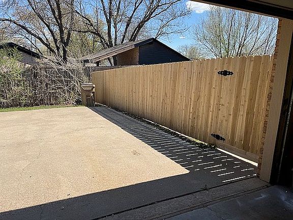 Gate by garage.