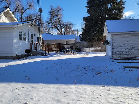 Large yard with patio at back.