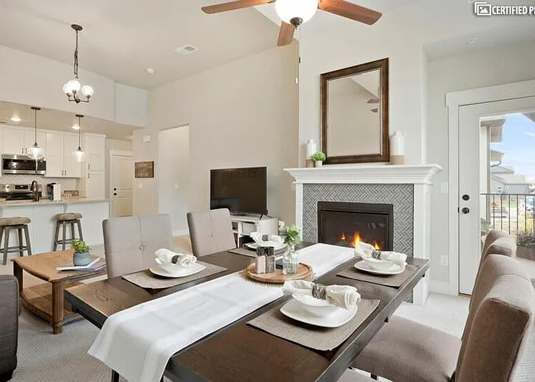 Open floorplan with fireplace and mountain view from patio