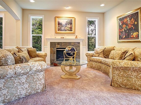 Classy and elegant are the statements for today with lush carpeting, tall windows overlooking the protected land to the West.  Turn on the gas fireplace and the music piped in through the built-in speakers and enjoy!