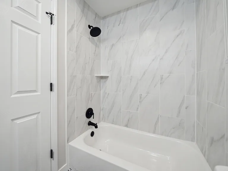 Fully Tiled Bath Surround with Pull Down Shower Screen