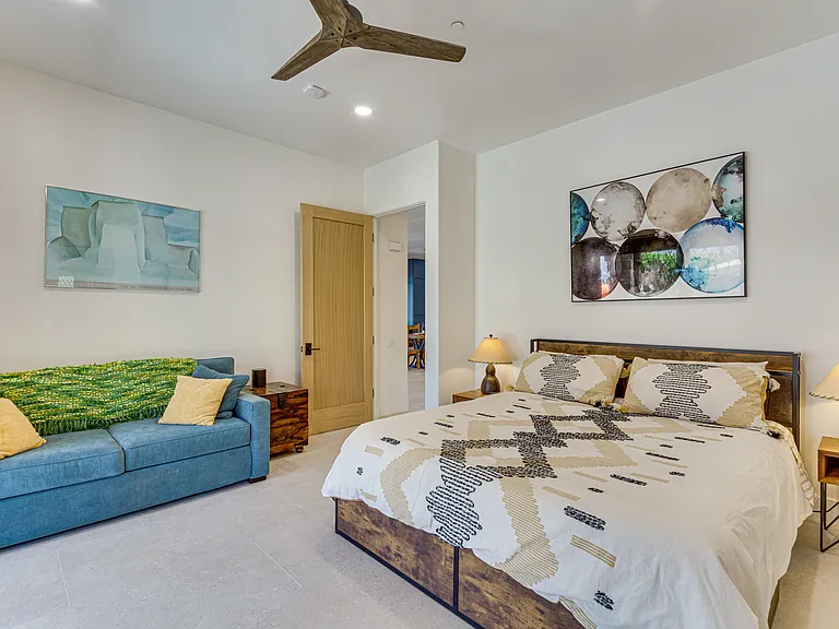 Large Primary Bedroom with mountain views our glass sliding doors
