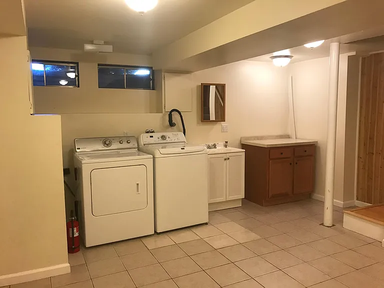 Washer and dryer with washing and folding stations