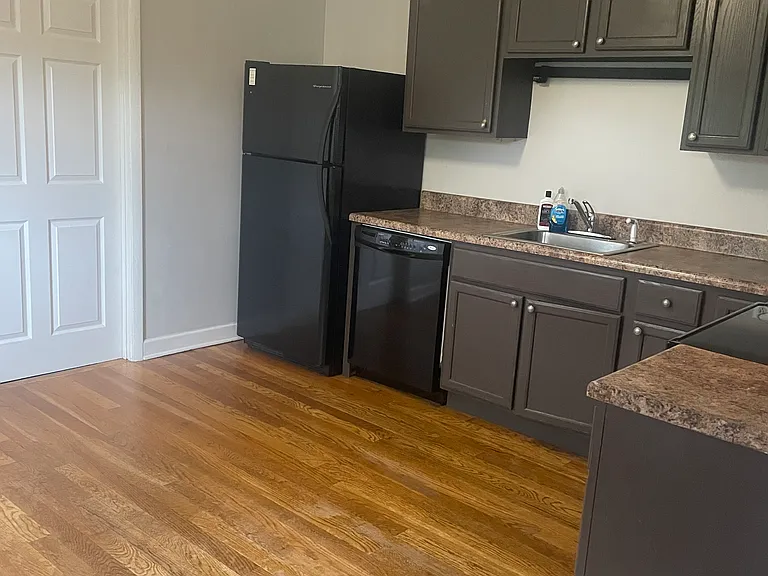 All electric appliances. Includes dishwasher, refrigerator microwave and stove. Door off kitchen leads to 1/2 bath and utility area that has washer/dryer hookups and the water heater.