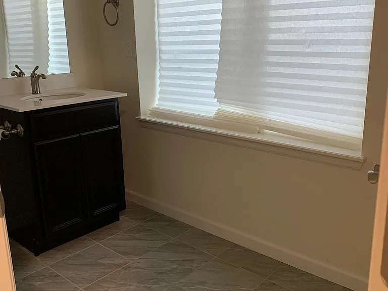 Good size 3/4 bathroom with shower in basement. New TDBU blind installed after this photo was taken