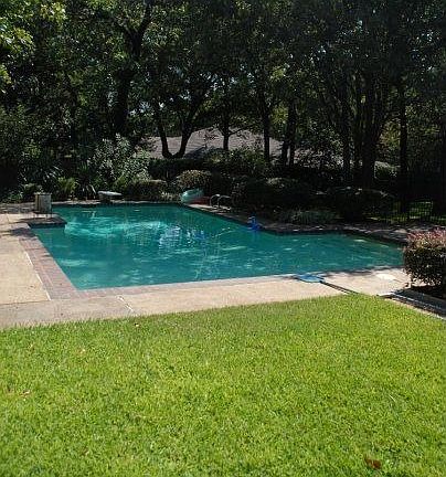 Large backyard with pool fenced