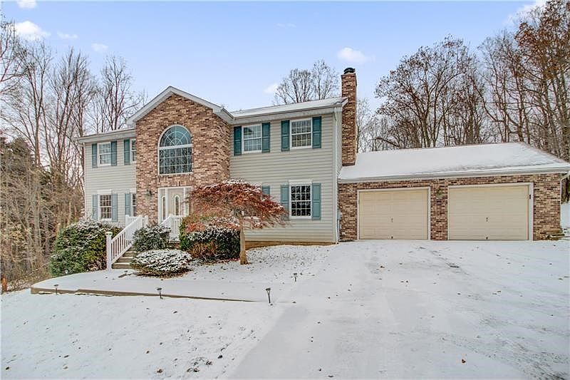 Welcome to 740 Dogwood Drive! The trees/woods wrap around this 1.54 acre private lot.  Brick and Alcoa Dutch Lap Clay Vinyl sidi