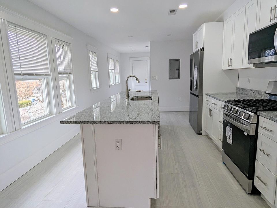 Brand new kitchen with center island dishwasher, and appliances