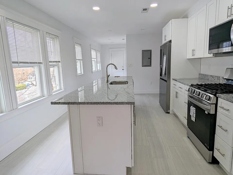 Brand new kitchen with center island dishwasher, and appliances