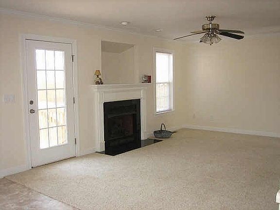 Spacious Living Room With Gas Fireplace and Built In TV Nook