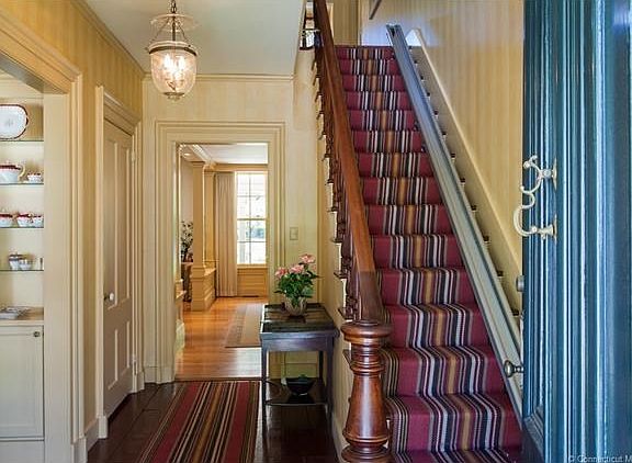Wide, inviting entry hallway draws your eye through to the back yard.