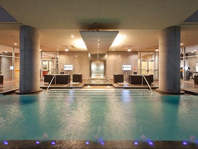 Two flat screen TVs flank the interior pool deck to allow you to catch a game.