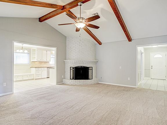 Living room. Wood fireplace. Vaulted ceilings.