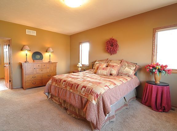 Master bedroom with 2 walk- in closets